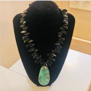 Black stone / bead  necklace with turquoise large pendant.